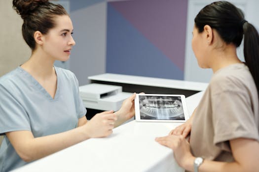 healthcare professional stretching at their desk