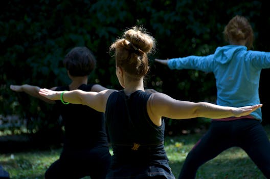 A group of healthcare professionals practicing yoga